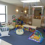 Kenrick Avenue KinderCare Photo #1 - Infant A is for our non-mobile Infants. In this room, we have many floor mobiles and other activites to keep your child stimulated during the day. Once they start to crawl and/or walk, they will transition to the Infant B Classroom. In this classroom, the teachers follow the exact schedule you are wanting for your Infant.