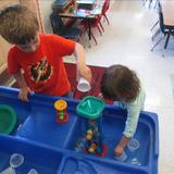 Wildflower Lane KinderCare Photo #5 - Exploring water in the sensory table in the Preschool room