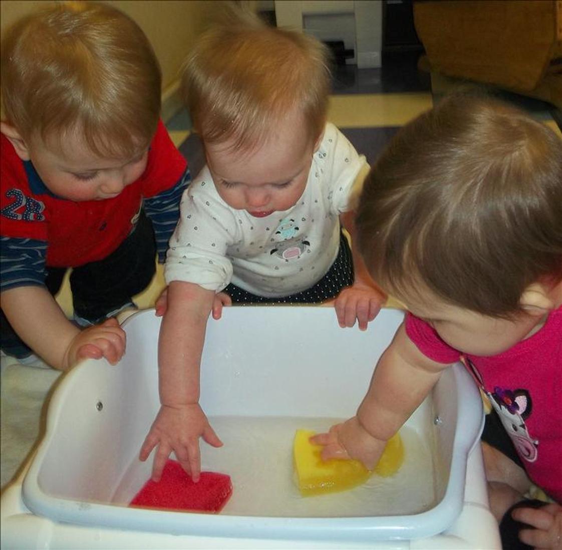 Center Grove KinderCare Photo #1 - Exploring water in the infant classroom