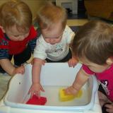Center Grove KinderCare Photo - Exploring water in the infant classroom