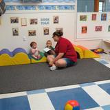 Pleasant Hill KinderCare Photo #1 - Reading a story on the climber!