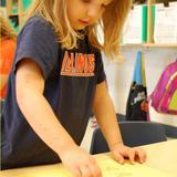 KinderCare of Huntley Photo #2 - Preschool is using letters to stamp with, one of the many ways we teacher letter recognition.