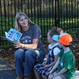 Aspen Academy Photo #12 - 8th grade mentor reading to her Pre-K mentees