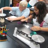 The Willow School Photo #1 - Middle schoolers conducting science experiments.