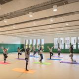 Chicago Jesuit Academy Photo #3 - CJA's multipurpose space allows a second space for indoor recess, music performances, cheer team practice, and (here) yoga/movement!