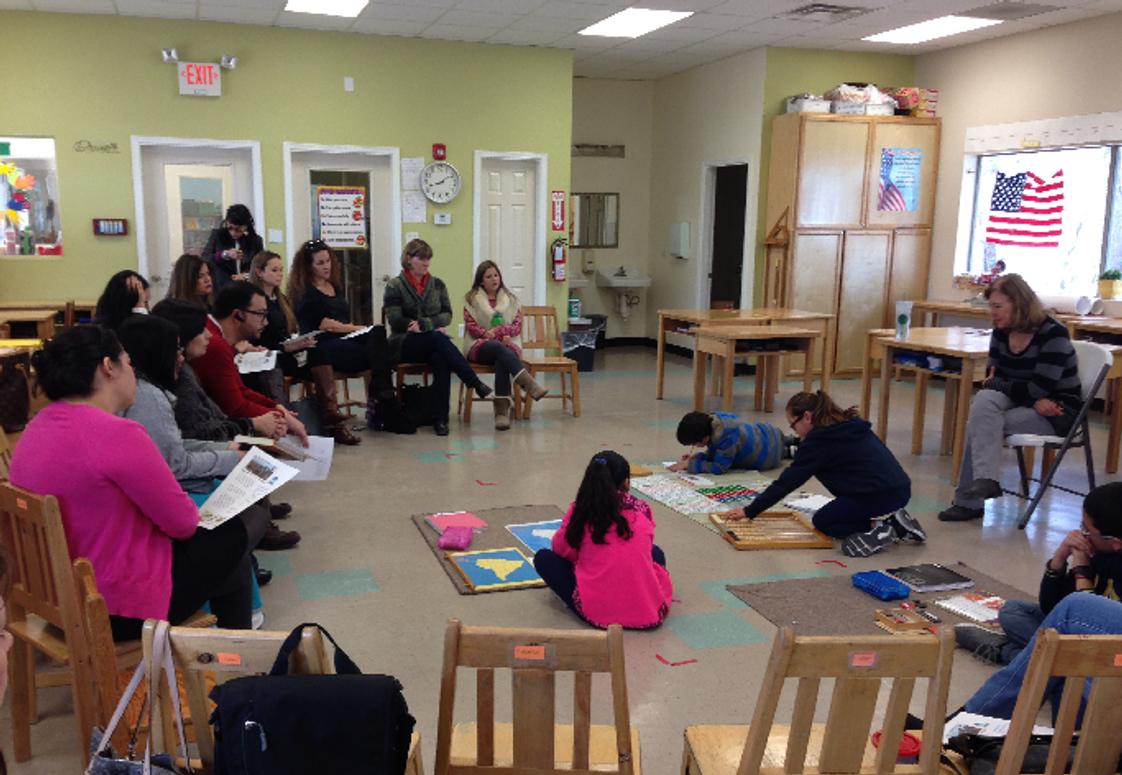 Mountain West Montessori School Photo #1 - Children show their work to parents during a Parent Meeting.