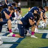 Second Baptist School Photo #12 - Second Baptist School football players pray in the endzone before their game.