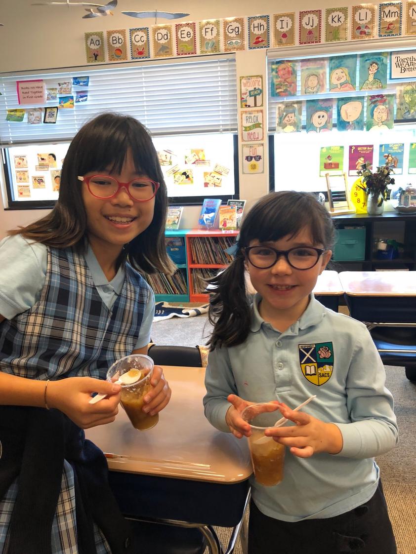 St. Andrew Catholic School Photo - 1st and 4th graders celebrate Johnny Appleseed day by making applesauce!