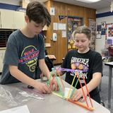 Trinity Lutheran Church & School Photo #9 - Fifth graders constructed bridges during E-Week (Engineering Week). The students were challenged to build truss bridges that were at least 10 inches in length using plastic straws and tape. The bridges were tested to see how much weight each could support.