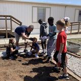 Trinity Lutheran Church & School Photo #17 - Our students cultivate their green thumbs in the springtime by helping to plant our school garden. Our students help start seedlings indoors and enjoy helping to prep the ground and transplant the seedlings when they are ready.