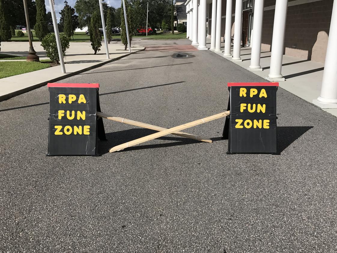 Renaissance Preparatory Academy Photo #1 - Children are dropped off at the edge of the parking lot and move into the Renaissance Preparatory Academy's pedestrian friendly, RPA Fun Zone.