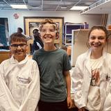 The Logan School for Creative Learning Photo #8 - Logan Students wearing "curious scientist" lab coats during class work time.