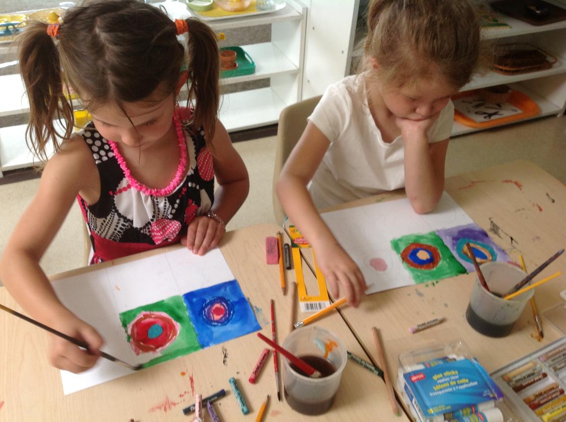 Montessori School at Lone Tree Photo #1 - Kindergarten children learn about artists. In this photo, they are painting in a style similar to Wassily Kandinsky.