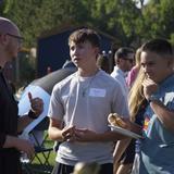 Mullen High School Photo #3 - Student speaking with Brother on campus