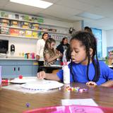 The Mcclelland School Photo #2 - The McClelland School's preschool and prekindergarten programs work on their fine motor skills with the help of older student "buddies." The students not only build a sense of community within the school but are able to learn from their student buddies.