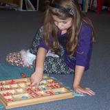 Boulder Knoll Montessori School Photo #4 - Learning to read using the Moveable Alphabet.