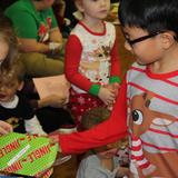 St. Mary Magdalen School Photo #6 - At the annual Student Secret Santa - grades Pre-K through 8 come together to exhange gifts that they made for one another to celebrate the Christmas season.