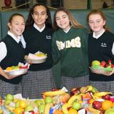 St. Mary Magdalen School Photo #2 - St. Mary Magdalen students assemble and deliver fruit baskets to families and friends that are homebound during the Thanksgiving season.