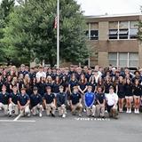 St. Paul Catholic High School Photo - Class of 2026 on the first day of school. Class prayer and traditional flag raising ceremony at the flag pole.