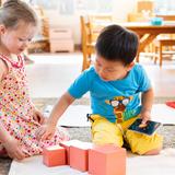 Wilmington Montessori School Photo #1 - Primary (3- to 6-year-old) Program - Preschool and Kindergarten - Students work together to create the Montessori Pink Tower.