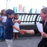 Battery Park Montessori, A Green Ivy International School Photo #9 - At Battery Park Montessori's End of Year Ceremony, students celebrate the growth and independence they've achieved, all against the backdrop of the beautiful Hudson River. With a firm handshake from their teacher, and with parents watching, each student takes a moment to reflect on their achievements.