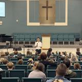 Adolesco Preparatory Academy Photo #9 - Students presenting to our school-wide monthly assembly we call Rise&Shine based on Isaiah 61. Here our Public Speaking course highlights the importance of a "good man speaking well" and provides students with opportunities to practice speaking boldly and confidently about Truth.