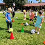 Village Preschool Academy Photo #7 - Soccer is another one of our free enrichment programs! Children love getting outside to not only stretch, run around, but learn new drills and play!