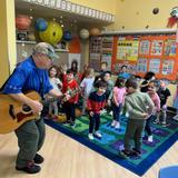Village Preschool Academy Photo #10 - Music Lessons are always a favorite at Village Preschool. Another one of our free enrichment programs. We love to learn new songs with Mr. Jack but we also enjoy learning about various kinds of music and new instruments too!