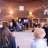 Hand In Hand Christian Montessori Photo #7 - Our Casa teacher brings the students together for a daily Bible devotional. Each classroom has an Atrium where students learn more about the God who created them.