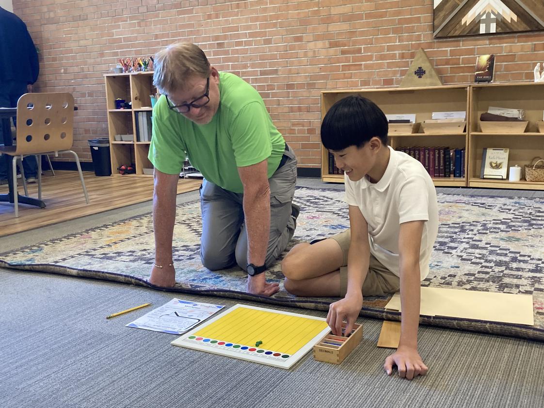 Hand In Hand Christian Montessori Photo #1 - Grandparents Day is a favorite for our students. They get to invite those special loved ones into their Montessori classrooms and present a lesson.