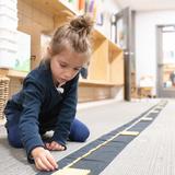 Hand In Hand Christian Montessori Photo #6 - The Montessori golden bead work is first discovered in our Casa (preschool) classrooms, where students learn counting, addition, and multiplication.