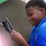Lake Rose Christian Academy Photo #18 - A Lake Rose Christian Academy student enjoys a quiet moment of reading, focused and engaged with his book.