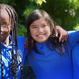 Lake Rose Christian Academy Photo #14 - Lake Rose Christian Academy students share a joyful moment together outdoors, smiling with arms around one another in a display of friendship and community.