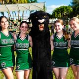 Pine Crest School Photo #7 - Upper School cheerleaders posing with the Pine Crest Panther mascot.