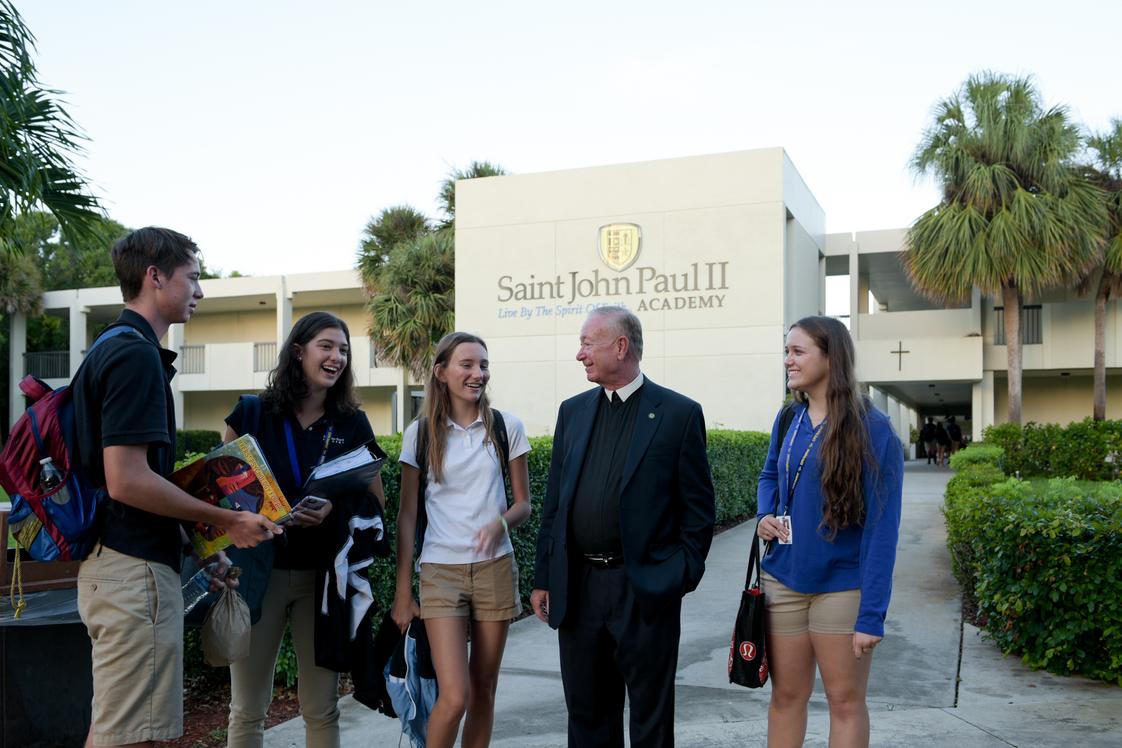 Saint John Paul II Academy Photo #1 - President Brother Daniel Aubin with students in the front of the Academy.