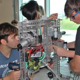 Saint John Paul II Academy Photo #4 - Robotics Club prepping for competition.