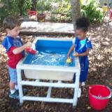 Sun Grove Montessori School Photo #8 - Enjoying fun with friends in the back garden.