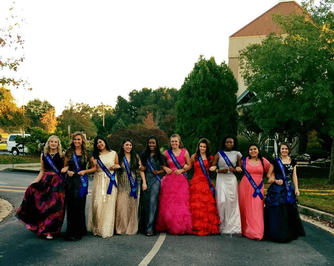 Peoples Baptist Academy Photo - The PBA Homecoming Court, chosen by peers, arrives by convertibles, and seniors by limousine, during football season.