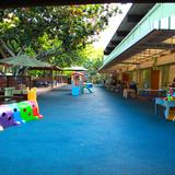 The Children's House Photo - Rubberized/Padded areas in front of the classrooms make for a fun, safe place to engage in activity.