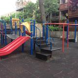 Park View Montessori School - Chicago Photo - We have a large outdoor playground with many beautiful trees, a large metal play structure, and three smaller play structures along with a climbing wall.