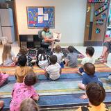 Spectrum School Photo - Julia reading the book "Alma" to our Early and Intermediate classes!