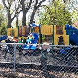 St. John Lutheran Early Learning Center Photo #6 - Our fenced playground provides an opportunity for outdoor play as the weather permits. There are lots of equipment options to help develop large motor skills.