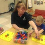 Bensenville KinderCare Photo #5 - Ms. Annette playing with the peg boards with the children.